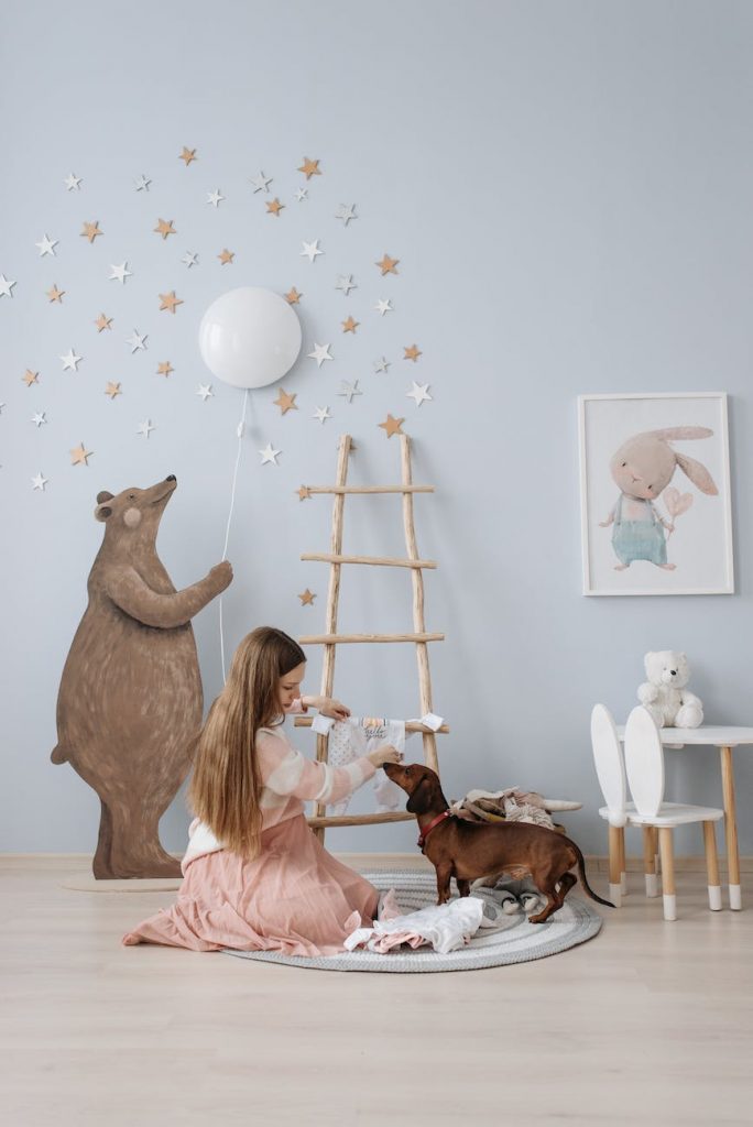 an expectant mother decorating the baby s room