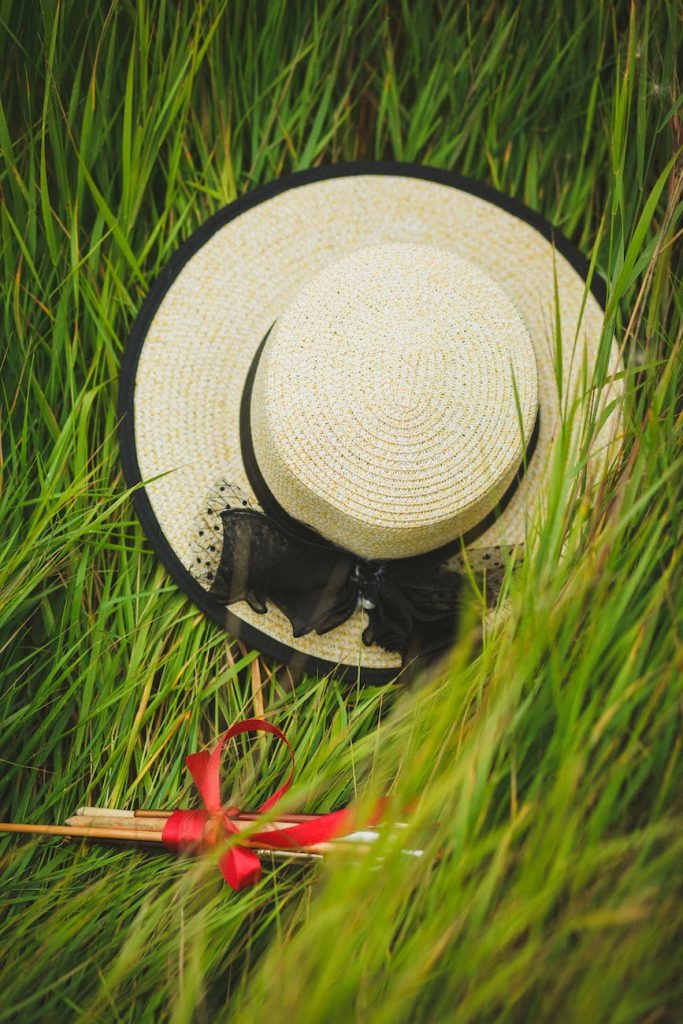 beige and black wicker hat